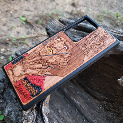 Freddy Krueger-inspired horror artwork engraved on a wooden phone case, compatible with iPhone  and Samsung Galaxy S.