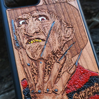Freddy Krueger-inspired horror artwork engraved on a wooden phone case, compatible with iPhone  and Samsung Galaxy S.