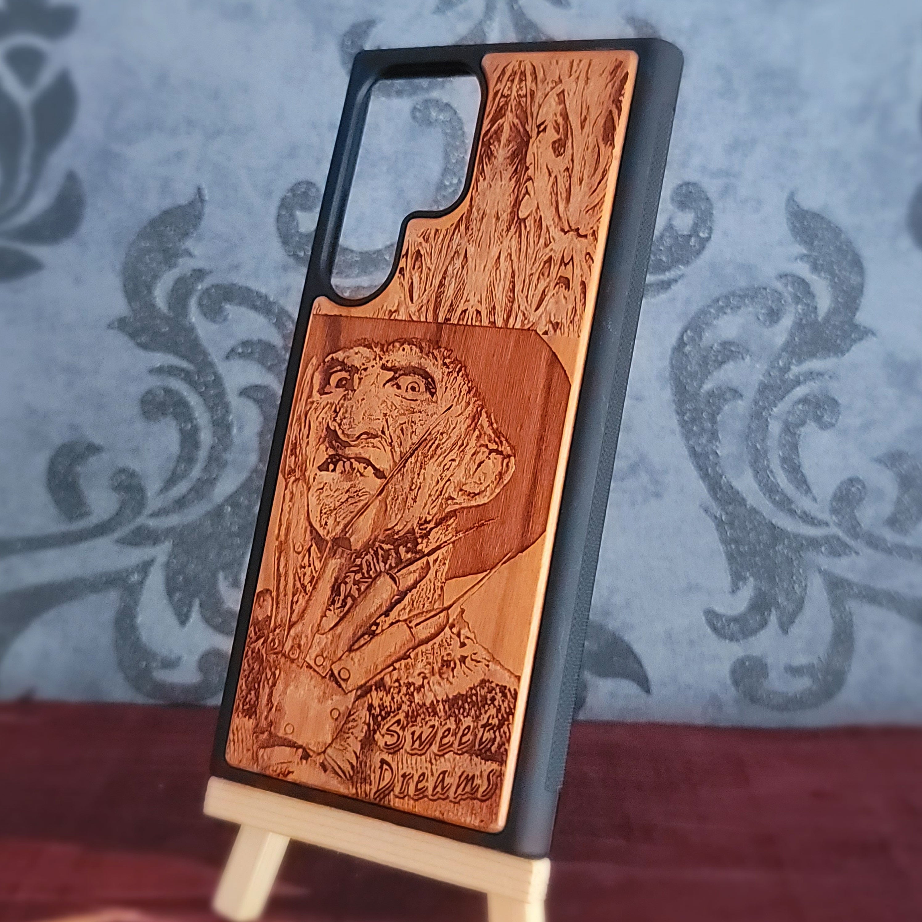 Laser-engraved wooden phone case with Freddy Krueger horror design, perfect for iPhone and Samsung Galaxy