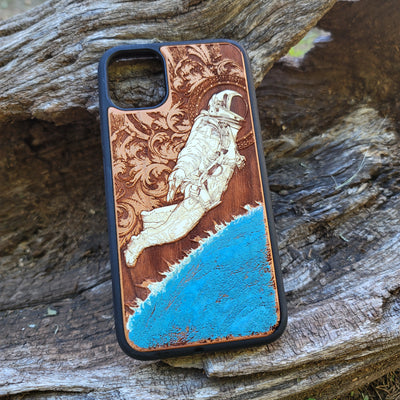 Laser-engraved wooden phone case for Samsung Galaxy, featuring intricate gothic artwork.