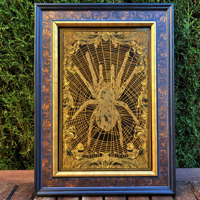 Tarantula spider wall art, gothic-style engraved wood with gold accents.
