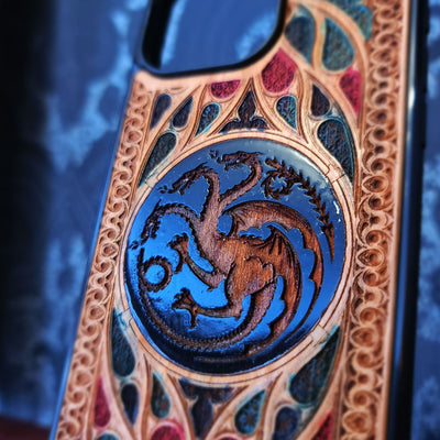 Decorative phone case with dragon emblem on a black background