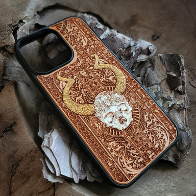 Close-up of laser-engraved cherrywood phone case with artistic design