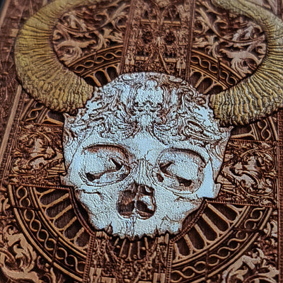 Close-up of laser-engraved cherrywood phone case with artistic design
