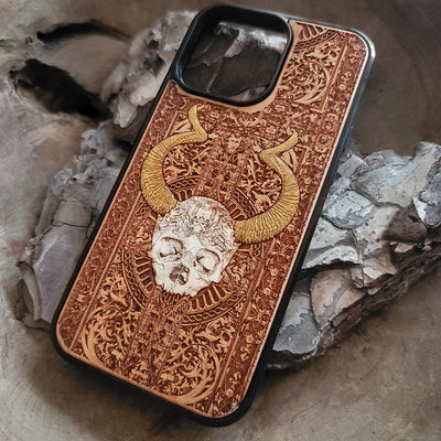 Close-up of laser-engraved cherrywood phone case with artistic design