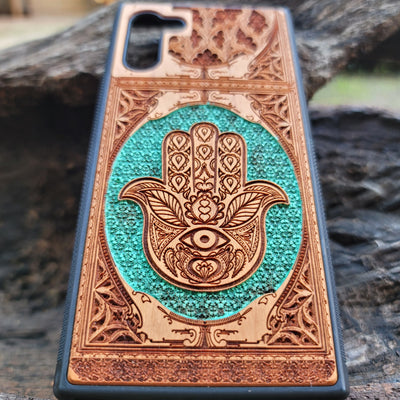 Hand-painted Hamsa Hand symbol wood phone case with Gothic pattern for iPhone & Samsung Galaxy. Laser-engraved design offers durability and style, compatible with iPhone , 15, 14, 13, 12, 11 Pro Max Mini & Samsung Galaxy S, S24, S23, S22, S21, S20 Ultra Plus Note 20.