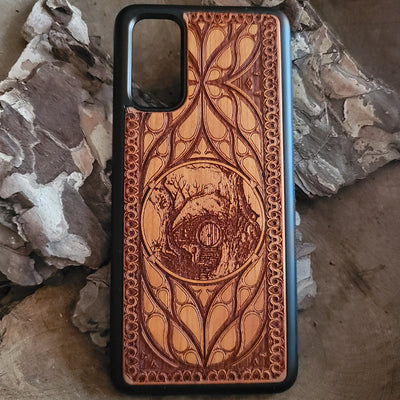 Wooden phone case for iPhone & Samsung Galaxy with Hobbit Door symbol, laser-engraved and hand-painted. Compatible with iPhone 15, 14, 13, 12, 11 Pro Max Mini and Samsung Galaxy S24, S23, S22, S21, S20 Ultra Plus Note 20. Slim, durable, and fantasy-inspired design.
