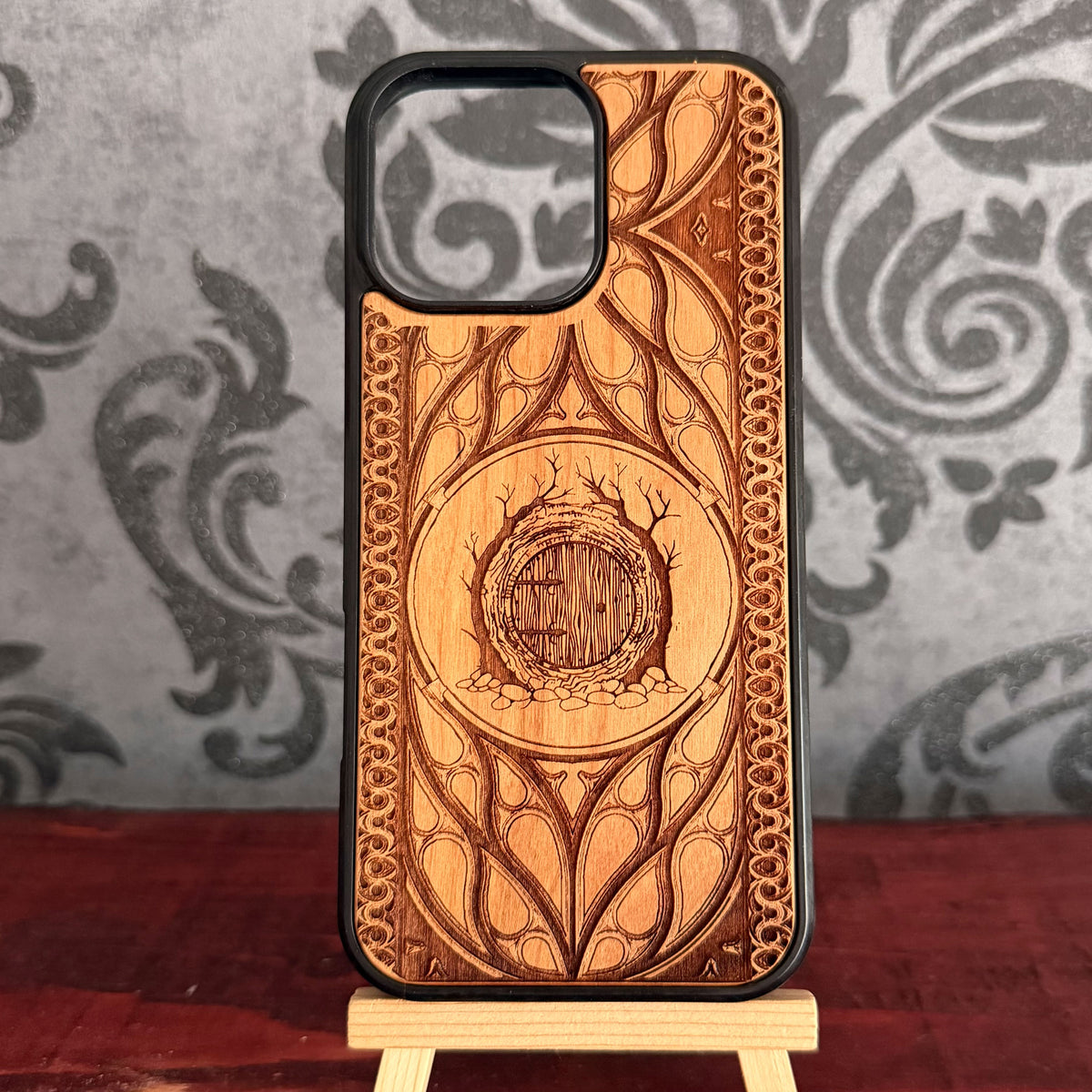 Fantasy Hobbit-style burrow entrance engraved on natural cherrywood phone case