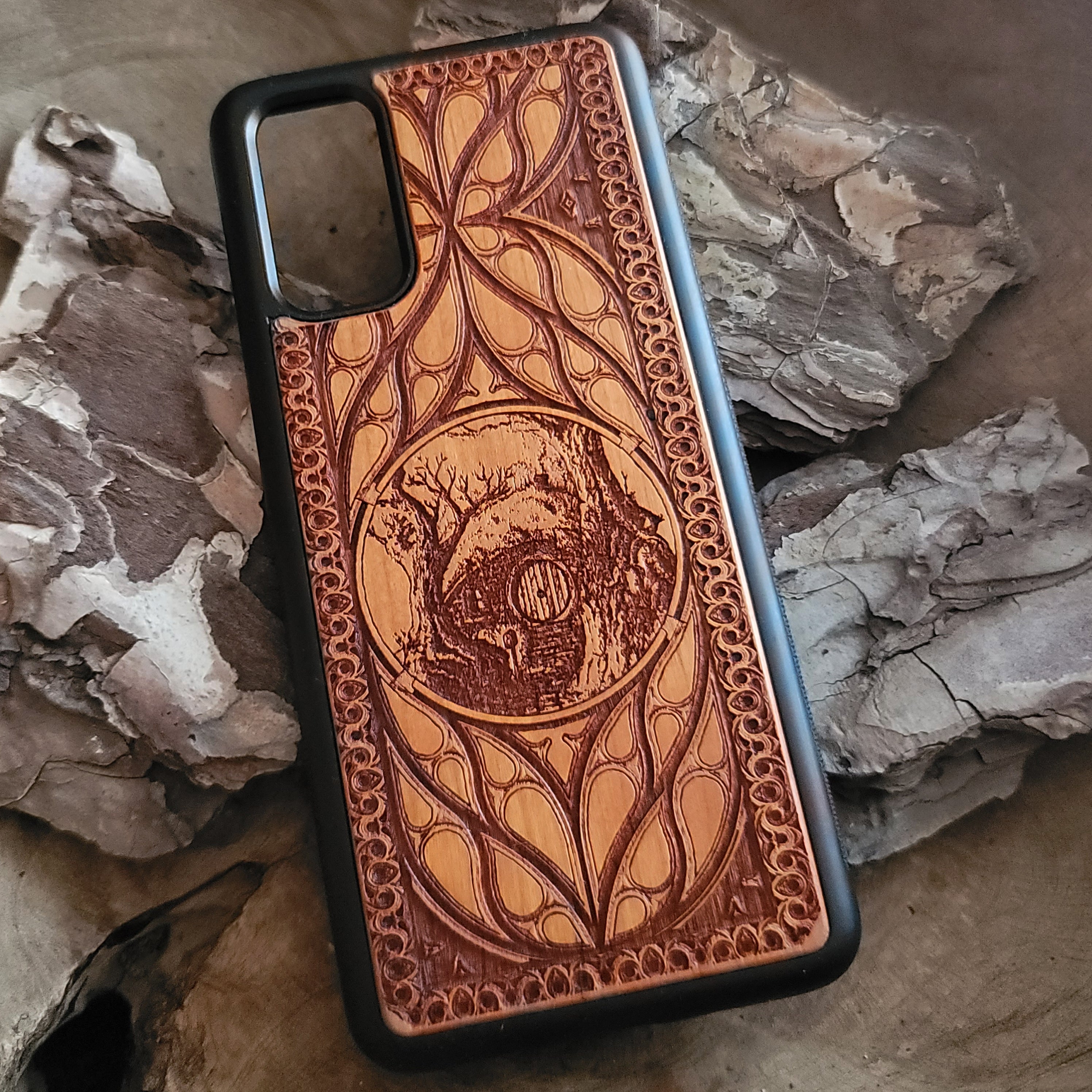 Wooden phone case for iPhone & Samsung Galaxy with Hobbit Door symbol, laser-engraved and hand-painted. Compatible with iPhone 15, 14, 13, 12, 11 Pro Max Mini and Samsung Galaxy S24, S23, S22, S21, S20 Ultra Plus Note 20. Slim, durable, and fantasy-inspired design.
