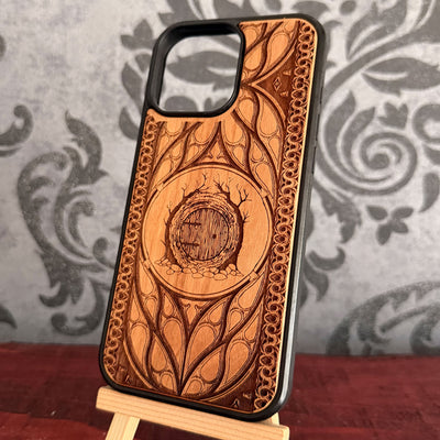 Round wooden fantasy door surrounded by tree roots laser engraved on cherrywood case