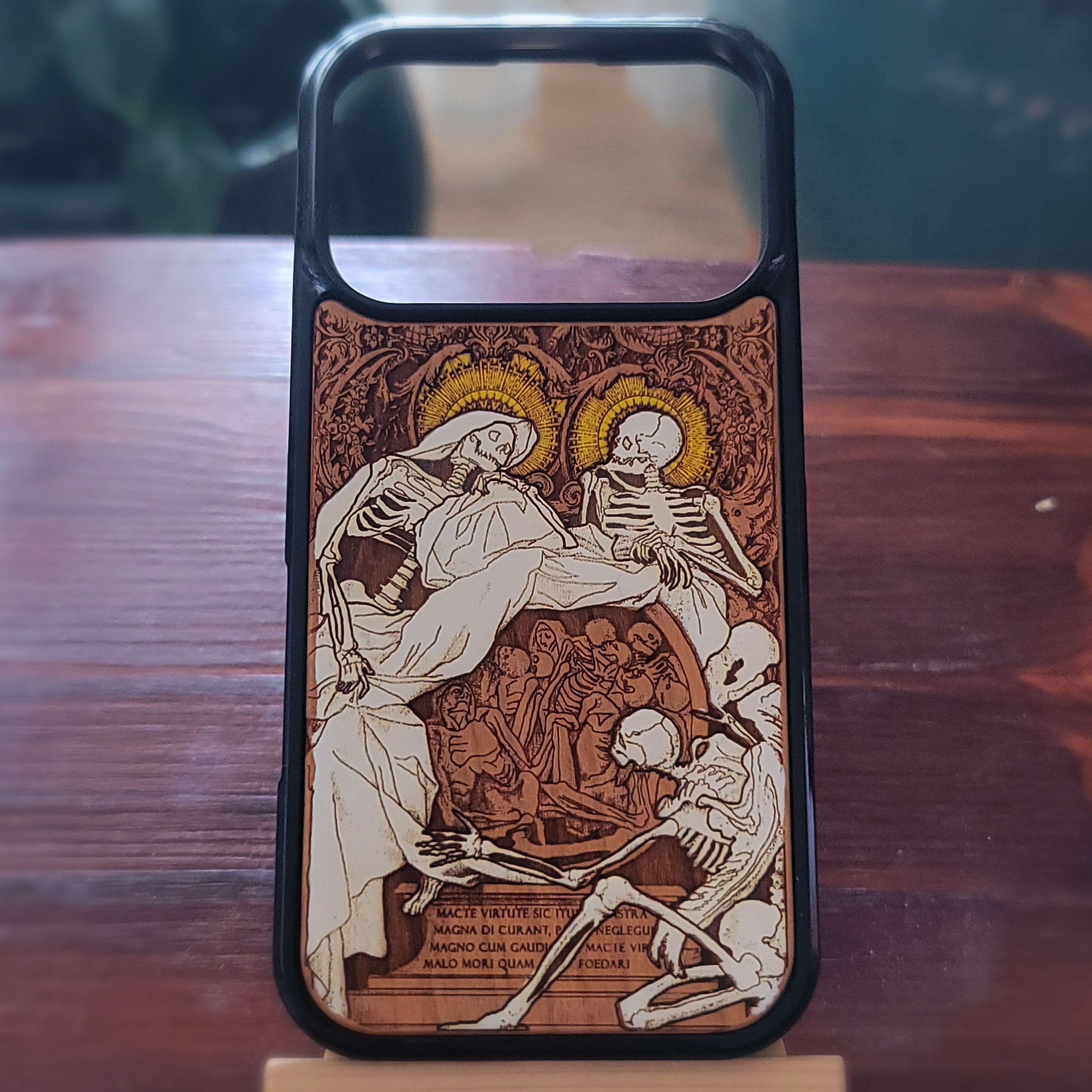 A wood phone case featuring a central skeleton and surrounding halos,