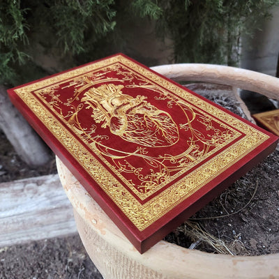 Wooden anatomical heart plaque in red, handcrafted gothic home decoration.