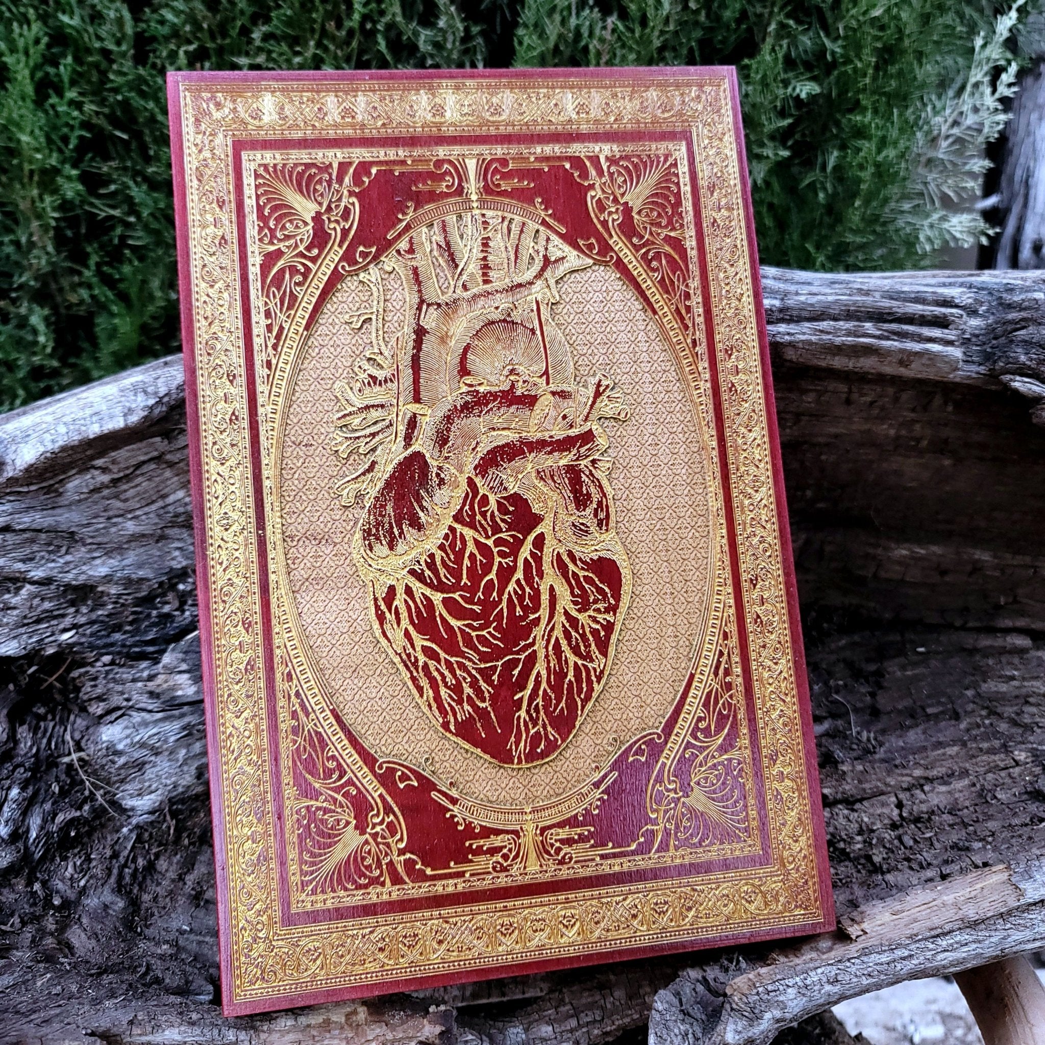 Handmade red anatomical heart art, perfect for gothic or alternative interiors.