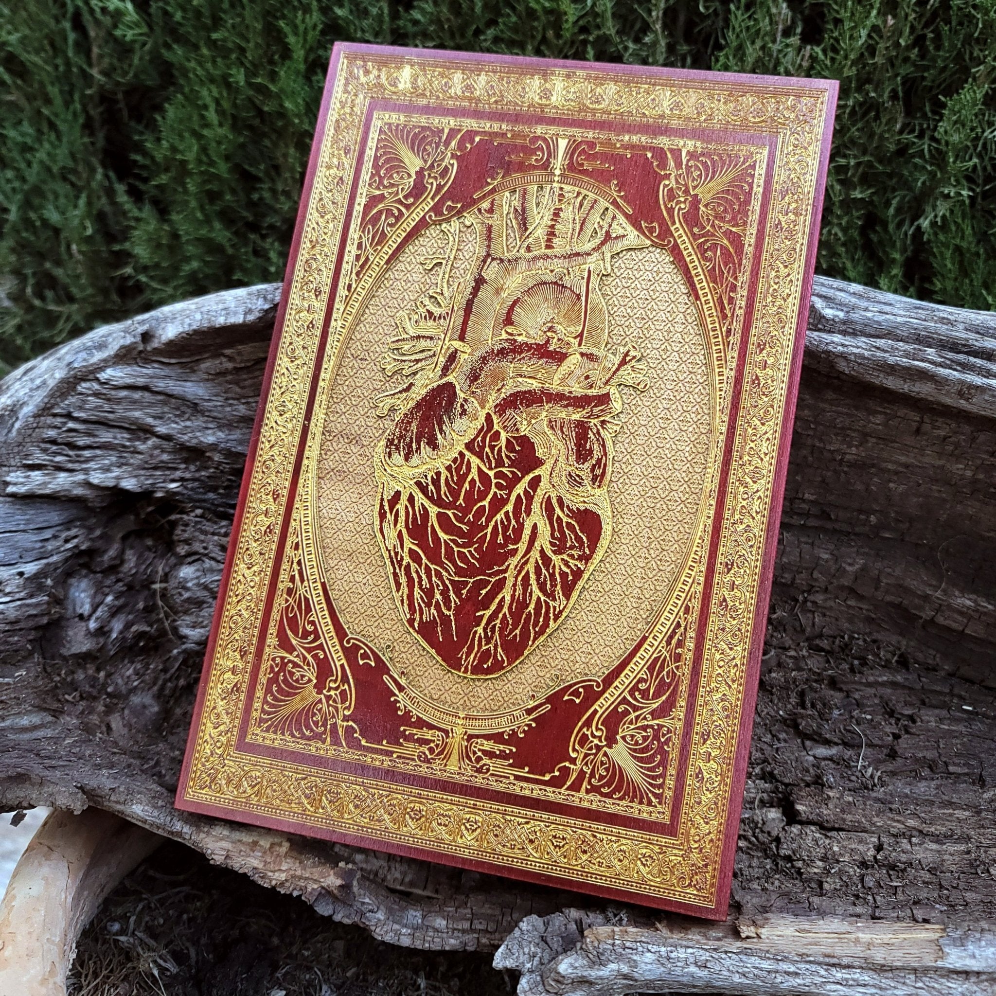Romantic gothic gift with red heart engraving on stained wood panel.