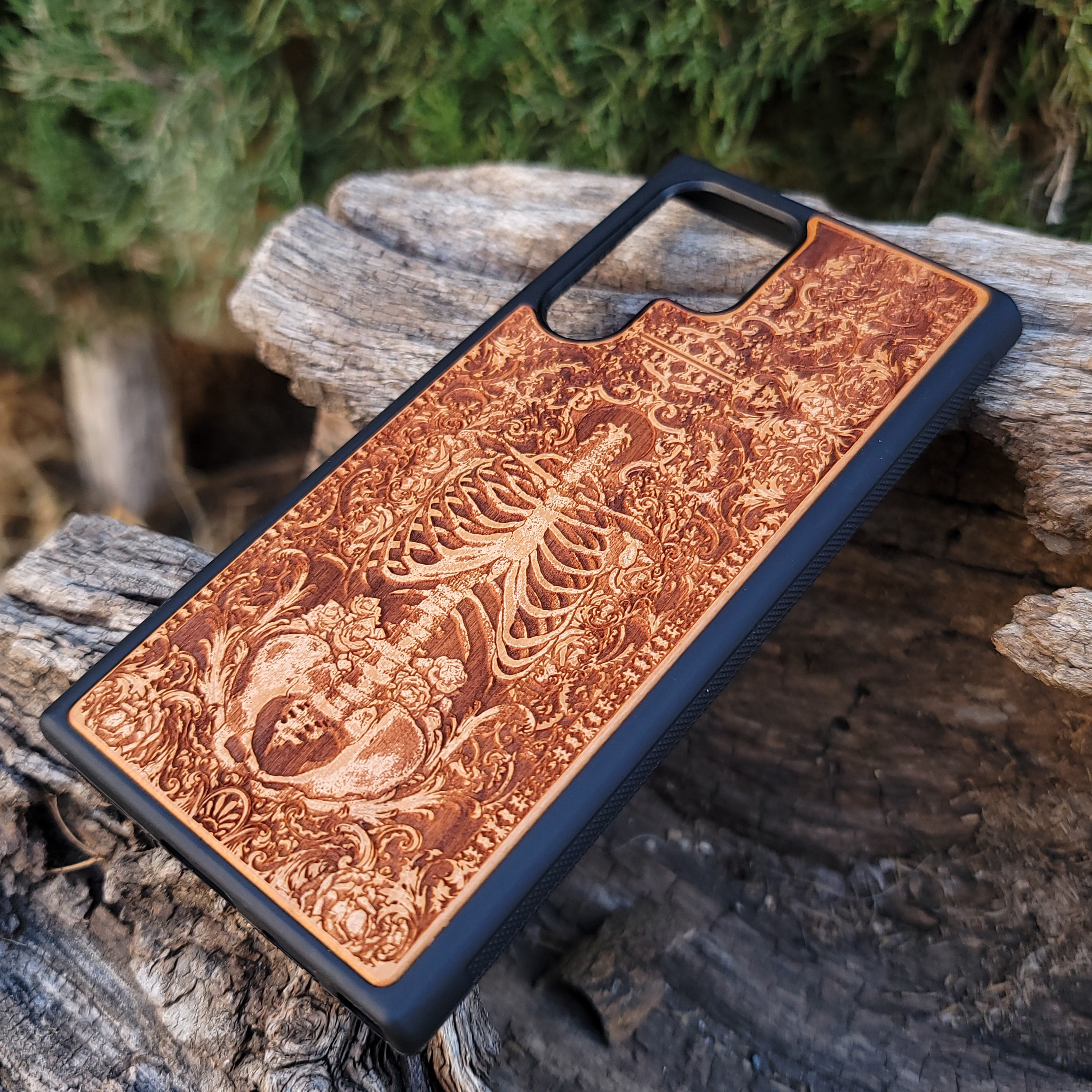 Wooden phone case with a detailed human skeleton torso and roses design, engraved for iPhone 16, iPhone 15, Galaxy S23 Ultra, Note 20, and more. Perfect for gothic art lovers seeking a unique phone accessory.