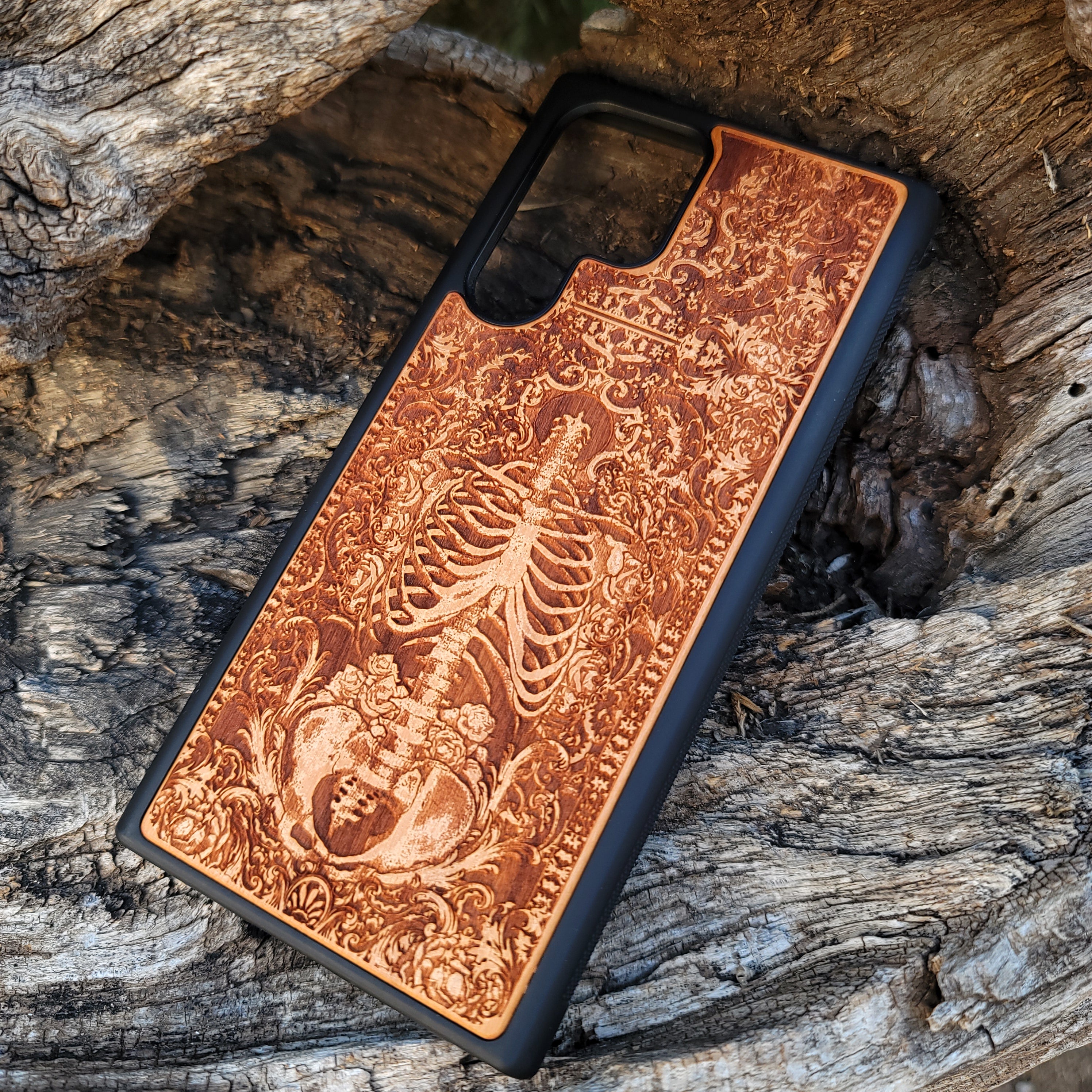 Wooden phone case with a detailed human skeleton torso and roses design, engraved for iPhone 16, iPhone 15, Galaxy S23 Ultra, Note 20, and more. Perfect for gothic art lovers seeking a unique phone accessory.
