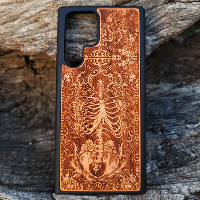 Wooden phone case with a detailed human skeleton torso and roses design, engraved for iPhone , iPhone 15, Galaxy S23 Ultra, Note 20, and more. Perfect for gothic art lovers seeking a unique phone accessory.