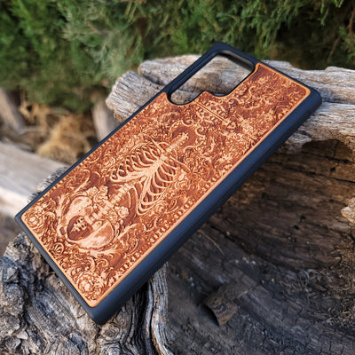 Wooden phone case with a detailed human skeleton torso and roses design, engraved for iPhone , iPhone 15, Galaxy S23 Ultra, Note 20, and more. Perfect for gothic art lovers seeking a unique phone accessory.