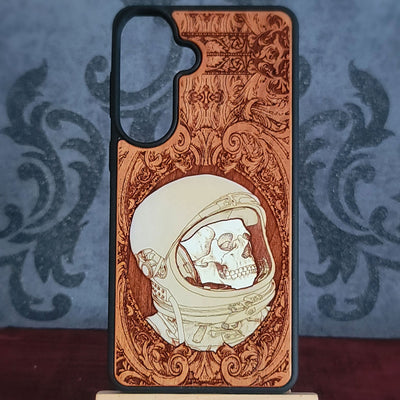 Hand-painted gothic wood phone case with astronaut skull design, compatible with iPhone  and Galaxy, featuring space horror art.