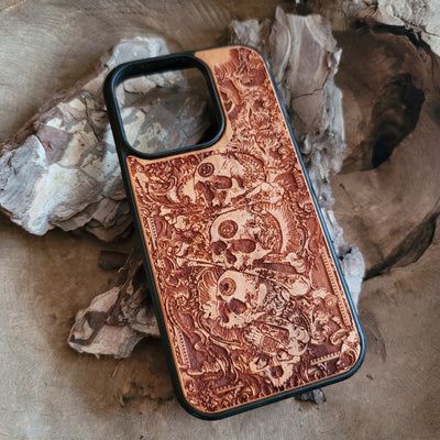 Handcrafted wooden phone case with detailed skull engravings inspired by medieval church architecture, compatible with iPhone , iPhone 15, iPhone 14, iPhone 13, iPhone 12, iPhone 11 Pro Max, iPhone 11 Mini, Samsung Galaxy S, S24, S23, S22, S21, S20 Ultra Plus, and Note 20.