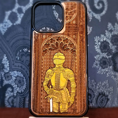 Deep laser engraved wooden phone case featuring a medieval knight in detailed armor holding a sword on natural wood for iPhone and Samsung Galaxy models.