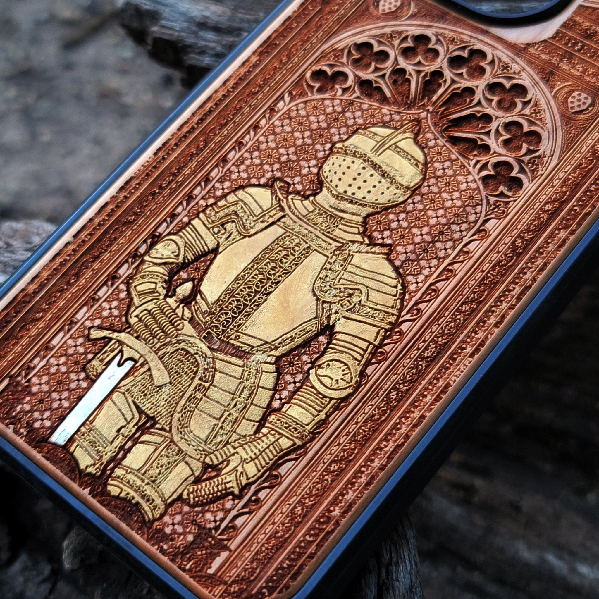 Wooden phone case featuring a medieval knight in armor, hand-painted with gold accents, laser-engraved on cherrywood. Compatible with iPhone -11 Pro Max, Galaxy S-S20. Historical and artistic phone case.