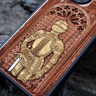 Wooden phone case featuring a medieval knight in armor, hand-painted with gold accents, laser-engraved on cherrywood. Compatible with iPhone -11 Pro Max, Galaxy S-S20. Historical and artistic phone case.