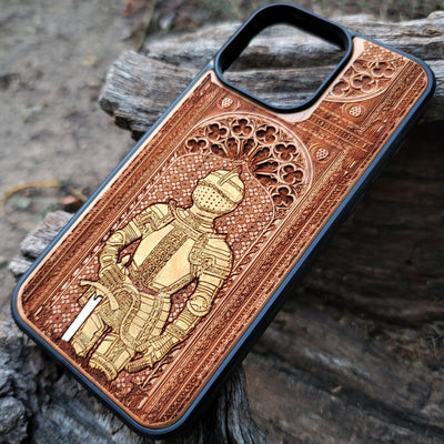 Wooden phone case featuring a medieval knight in armor, hand-painted with gold accents, laser-engraved on cherrywood. Compatible with iPhone -11 Pro Max, Galaxy S-S20. Historical and artistic phone case.