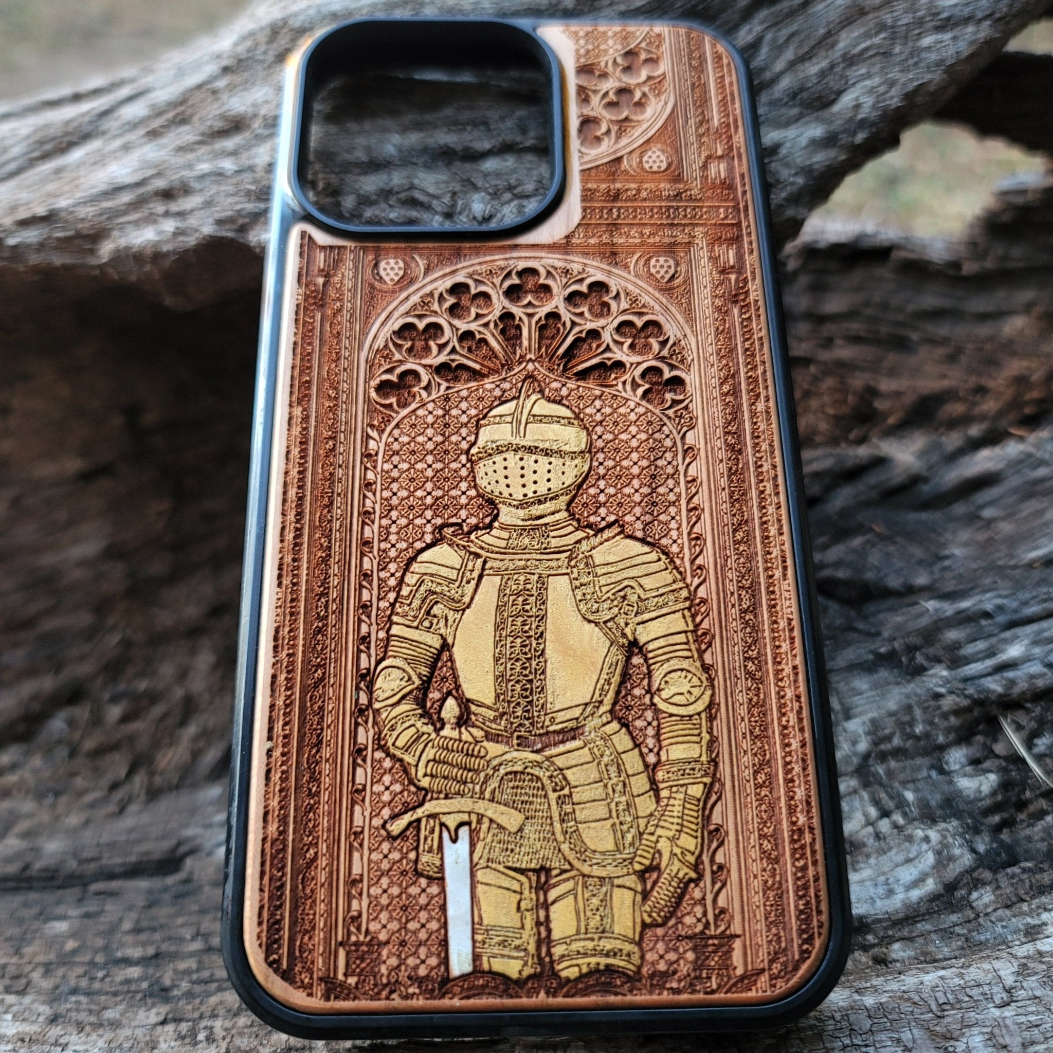 Wooden phone case featuring a medieval knight in armor, hand-painted with gold accents, laser-engraved on cherrywood. Compatible with iPhone -11 Pro Max, Galaxy S-S20. Historical and artistic phone case.