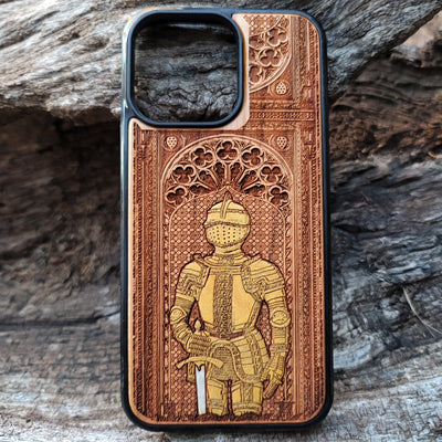 Wooden phone case featuring a medieval knight in armor, hand-painted with gold accents, laser-engraved on cherrywood. Compatible with iPhone -11 Pro Max, Galaxy S-S20. Historical and artistic phone case.