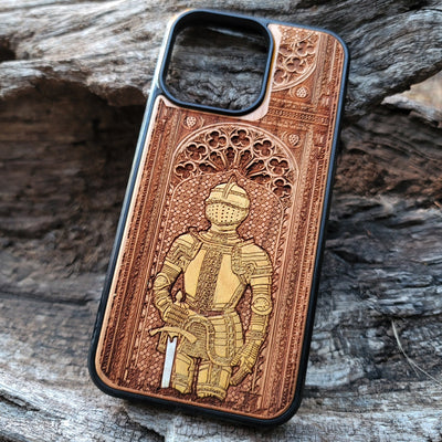 Wooden phone case featuring a medieval knight in armor, hand-painted with gold accents, laser-engraved on cherrywood. Compatible with iPhone -11 Pro Max, Galaxy S-S20. Historical and artistic phone case.