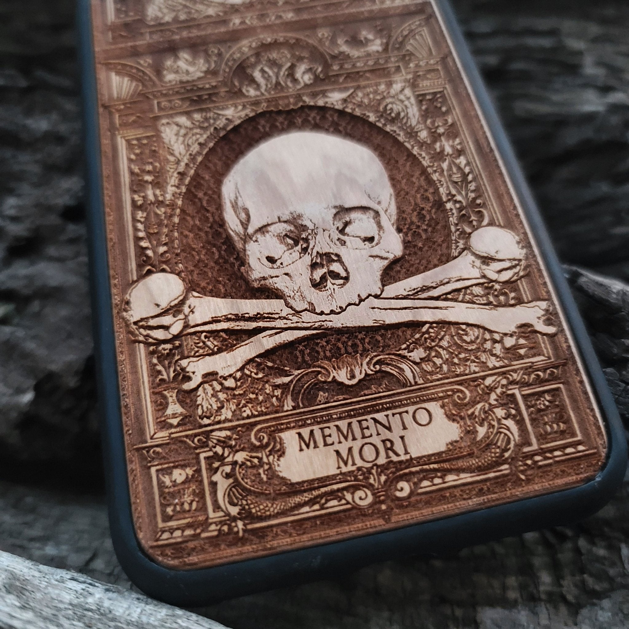 Wooden Memento Mori II phone case with intricate gothic skull design, compatible with iPhone , iPhone 15, Galaxy S, Galaxy S24, and other models. Ideal for horror and gothic art lovers.