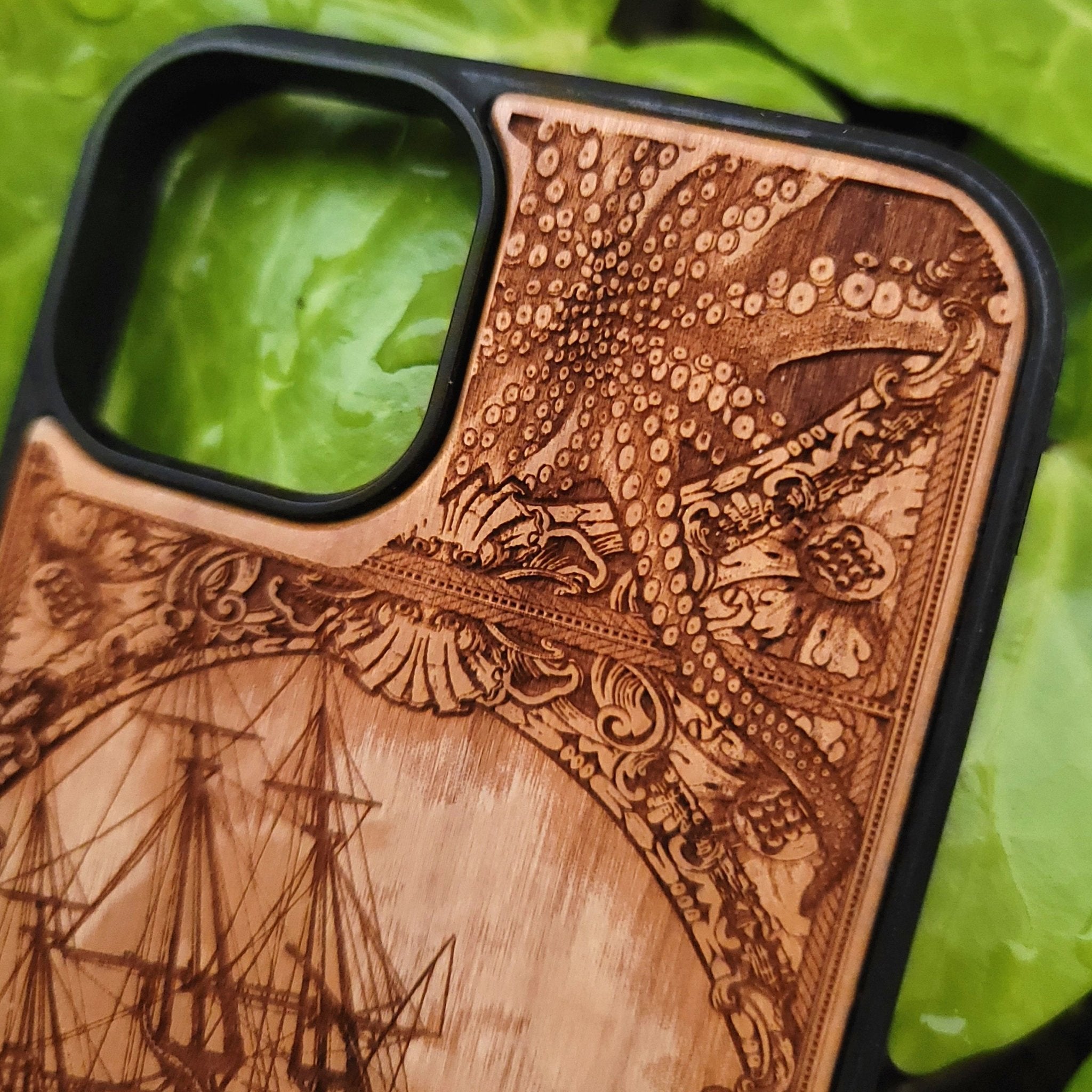 Wood phone case engraved with Kraken sea monster eating a ship, fits iPhone –11 and Samsung Galaxy S–S20