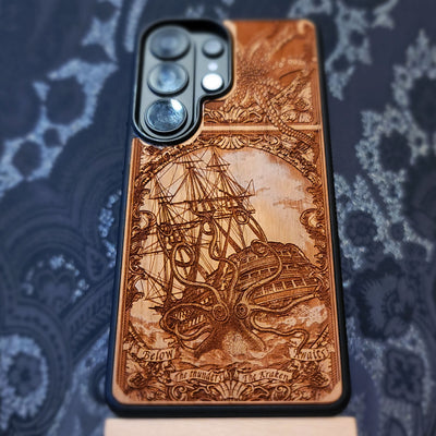 Laser engraved and hand painted wooden phone case featuring a giant Kraken sea monster attacking a ship for iPhone and Samsung Galaxy models.