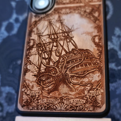 Laser engraved and hand painted wooden phone case featuring a giant Kraken sea monster attacking a ship for iPhone and Samsung Galaxy models.