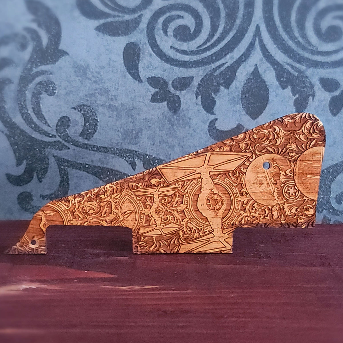 Engraved cherry wood Les Paul style pickguard with detailed sci fi starfighter and space battle artwork