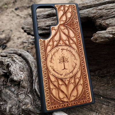 "Lord of the Rings White Tree of Gondor wood phone case, laser-engraved with intricate Elvish script and decorative patterns. This durable and protective case is compatible with iPhone , 15, 14, 13, 12, 11, Pro Max, Mini, and Samsung Galaxy S, S24, S23, S22, S21, S20 Ultra, Plus, Note 20. Elegant, slim, and perfect for Tolkien fans seeking a unique phone accessory."