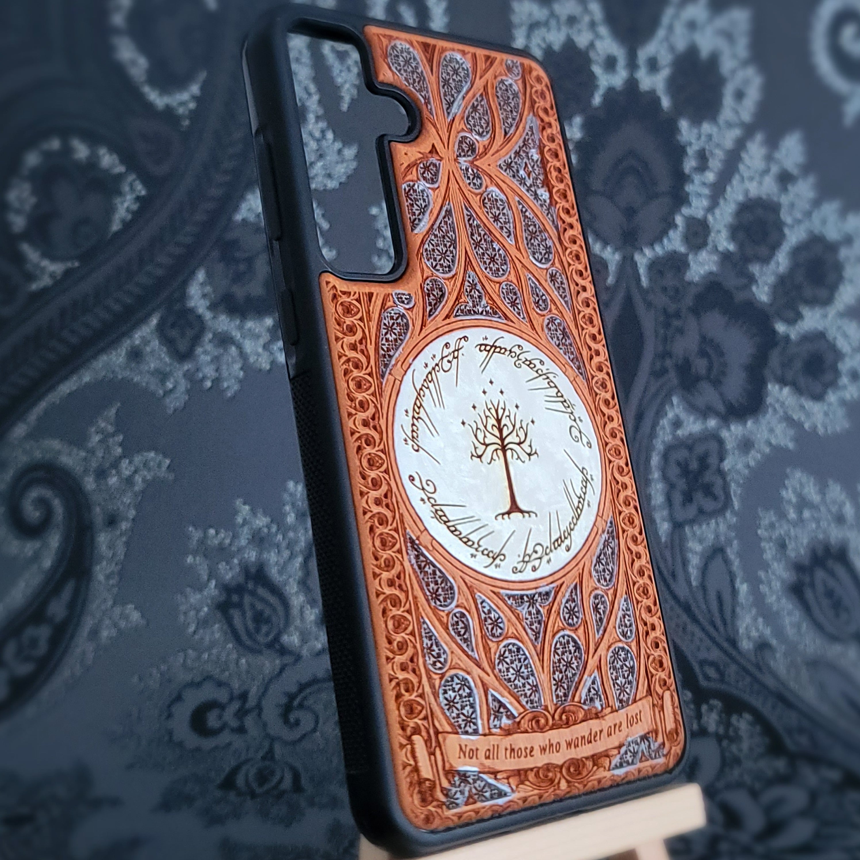 Phone case with intricate design on a patterned background