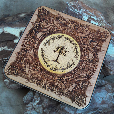 Close-up of elven symbols from Middle-earth painted on wireless charger.
