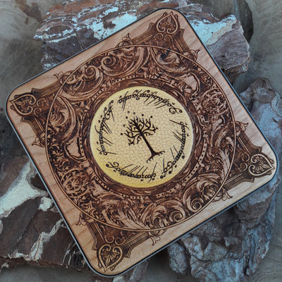 Side view of hand-painted Tolkien inscription on wood charger.
