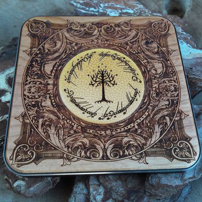 Top-down angle of Middle-earth map symbols painted on charger.