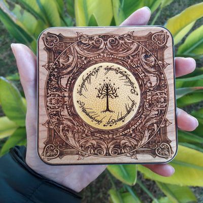 Dark wood wireless charger with hand-painted One Ring inscription.