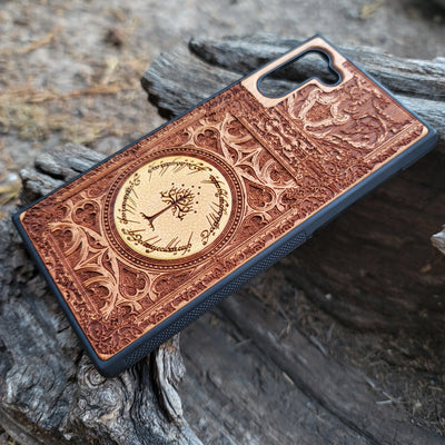 Lord of the Rings Gothic wood phone case featuring intricate laser-engraved designs inspired by Tolkien's Middle-Earth. The design includes Elvish script and Gothic elements, creating a dramatic, elegant look. Compatible with iPhone , 15, 14, 13, 12, 11 Pro Max Mini and Samsung Galaxy S, S24, S23, S22, S21, S20 Ultra, Plus, and Note 20. A stylish, durable, and unique accessory for LOTR fans.