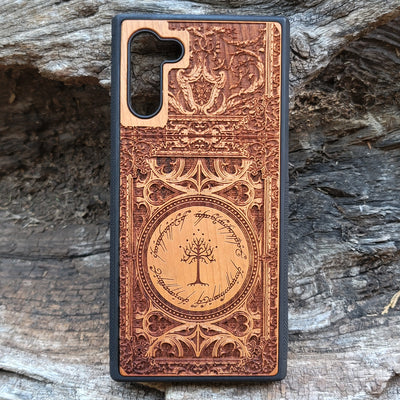 Wooden phone case with a detailed laser-engraved Gothic design, featuring intricate patterns and an elegant look. Compatible with iPhone , 15, 14, 13, 12, 11 Pro Max Mini and Samsung Galaxy S, S24, S23, S22, S21, S20 Ultra, Plus, Note 20. A perfect accessory for gothic art enthusiasts.