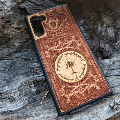 Lord of the Rings Gothic wood phone case featuring intricate laser-engraved designs inspired by Tolkien's Middle-Earth. The design includes Elvish script and Gothic elements, creating a dramatic, elegant look. Compatible with iPhone , 15, 14, 13, 12, 11 Pro Max Mini and Samsung Galaxy S, S24, S23, S22, S21, S20 Ultra, Plus, and Note 20. A stylish, durable, and unique accessory for LOTR fans.