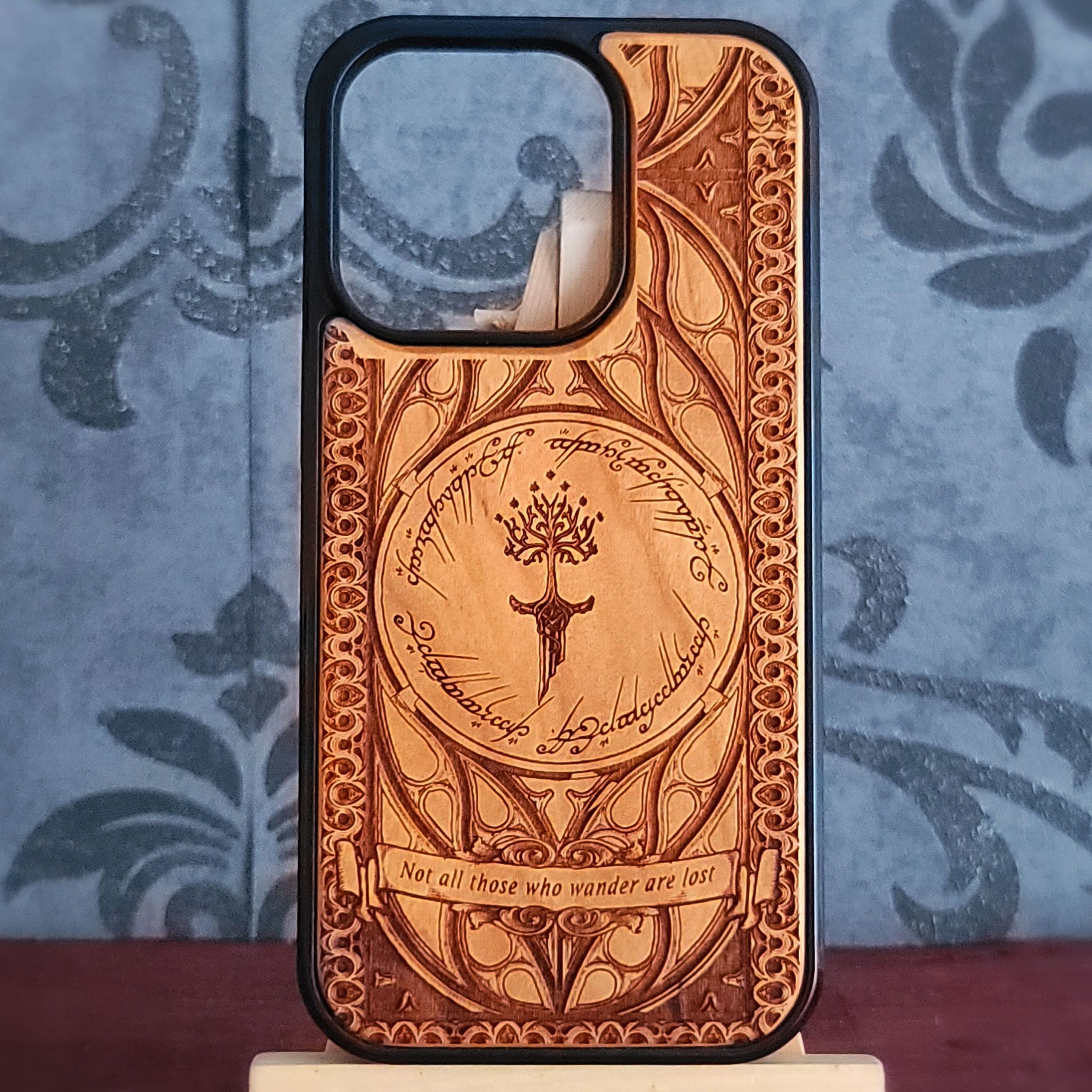 Lord of the Rings wood phone case featuring the White Tree of Gondor, Elvish script, and the iconic quote 'Not all those who wander are lost.' Laser-engraved for intricate detailing and crafted for durability, this case is compatible with iPhone and Samsung Galaxy 