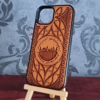 Lord of the Rings wood phone case featuring the Fellowship of the Ring silhouette surrounded by Elvish script and intricate, elegant patterns. 