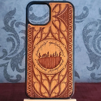 Lord of the Rings wood phone case featuring the Fellowship of the Ring silhouette surrounded by Elvish script and intricate, elegant patterns. 