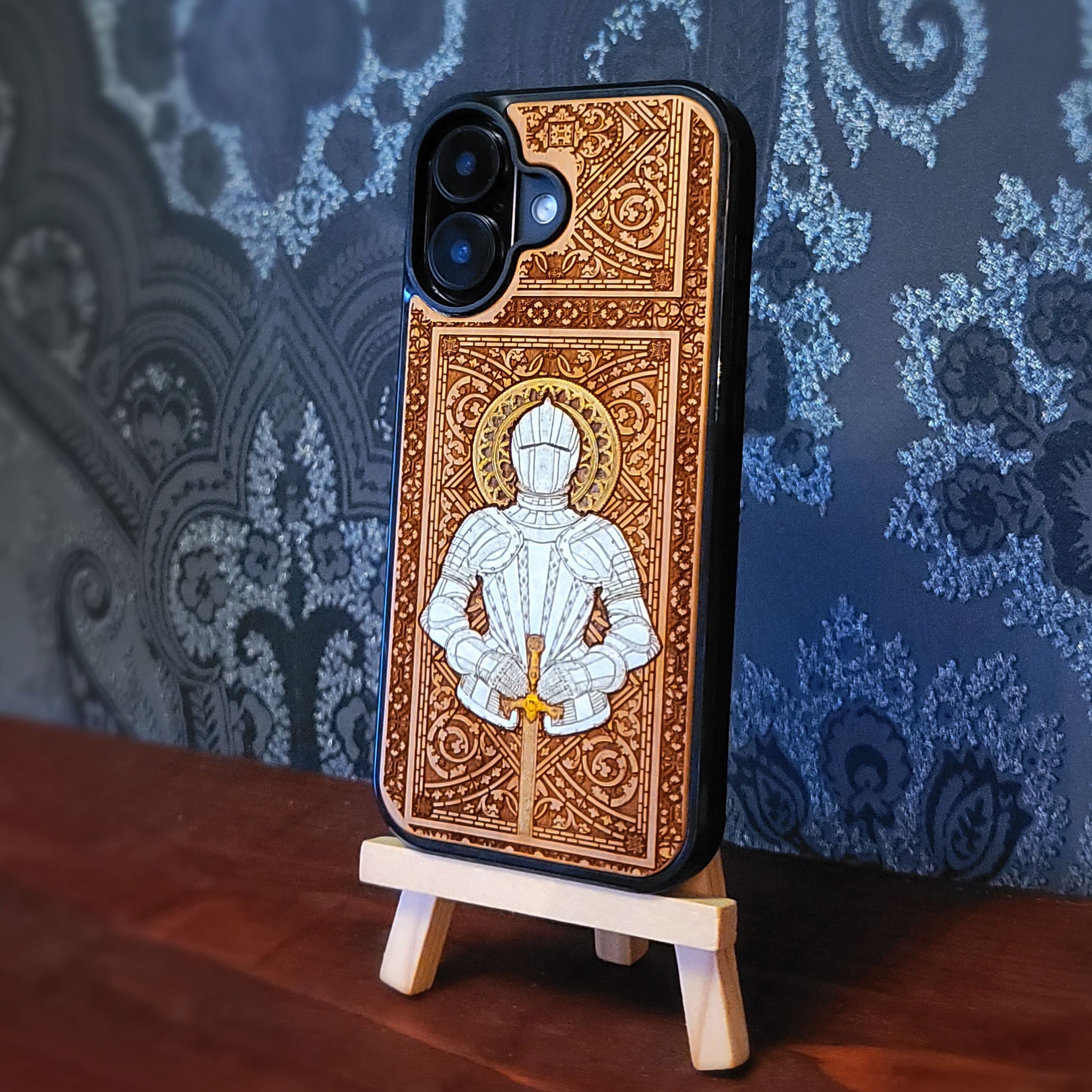Laser engraved and hand painted wooden phone case featuring a medieval knight in silver armor holding a sword for iPhone and Samsung Galaxy models.