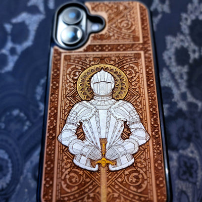 Laser engraved and hand painted wooden phone case featuring a medieval knight in silver armor holding a sword for iPhone and Samsung Galaxy models.
